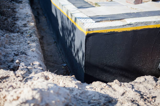 Professional Waterproofing technician working in Rolling Meadows, IL
